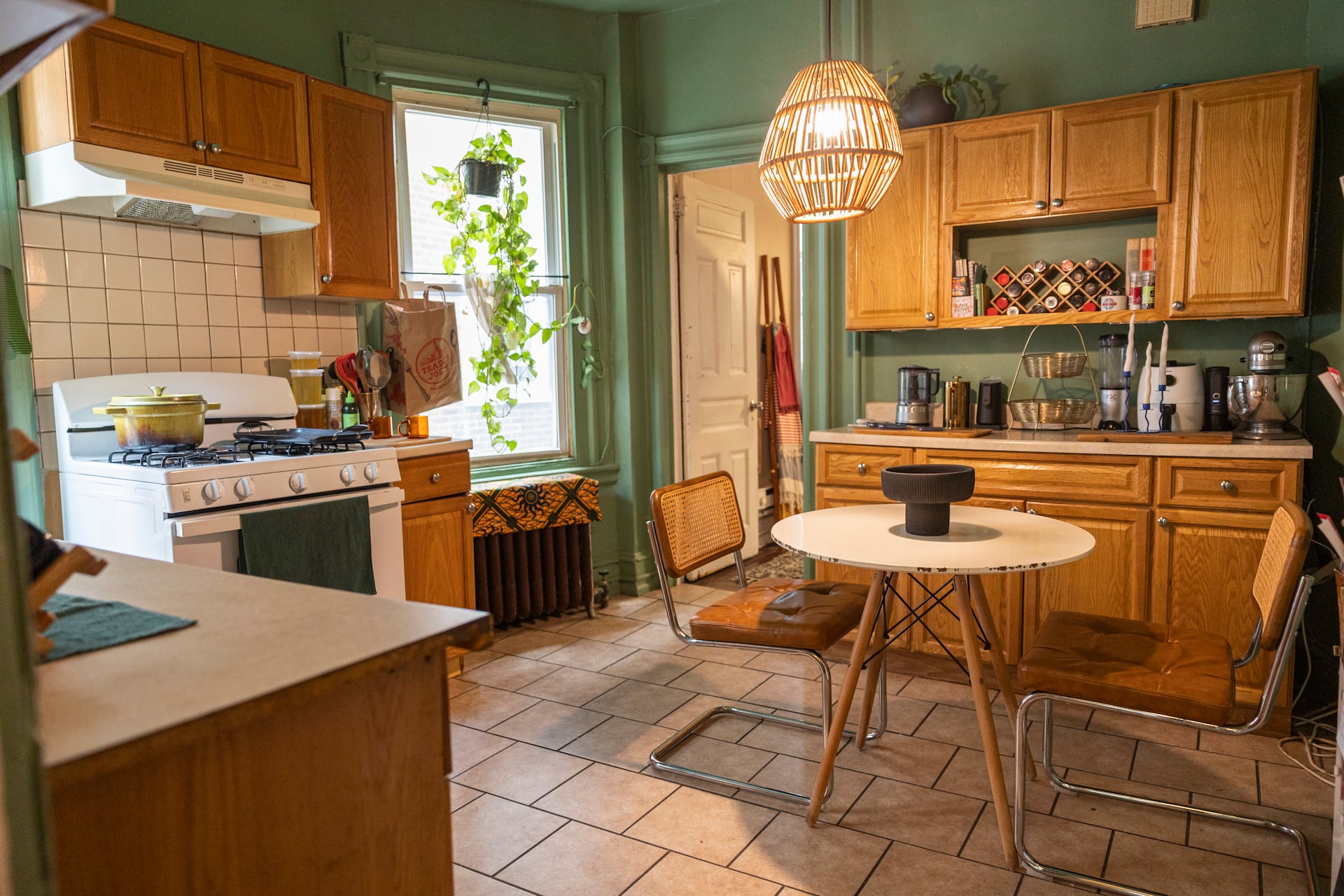 Baker Ashley Huston color-drenched her kitchen in sage green paint — the same color she used in her bakery, DreamWorld Bakes.