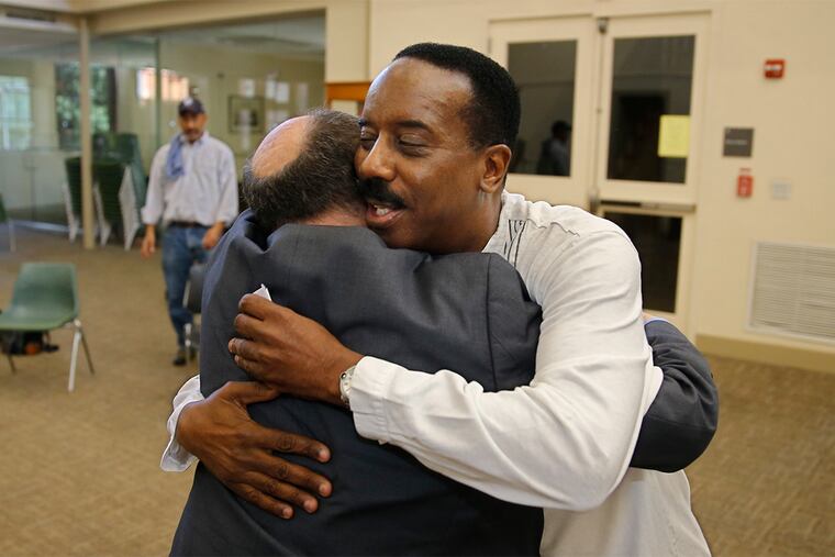At the Philadelphia Interfaith Press Conference Mark Segal, the publisher of the Philadelphia Gay News,left, gets a hug from Imam Salaam Muhsin, right, after Segal gave a very emotional speech about how the shootings in Orlando have impacted the gay community.