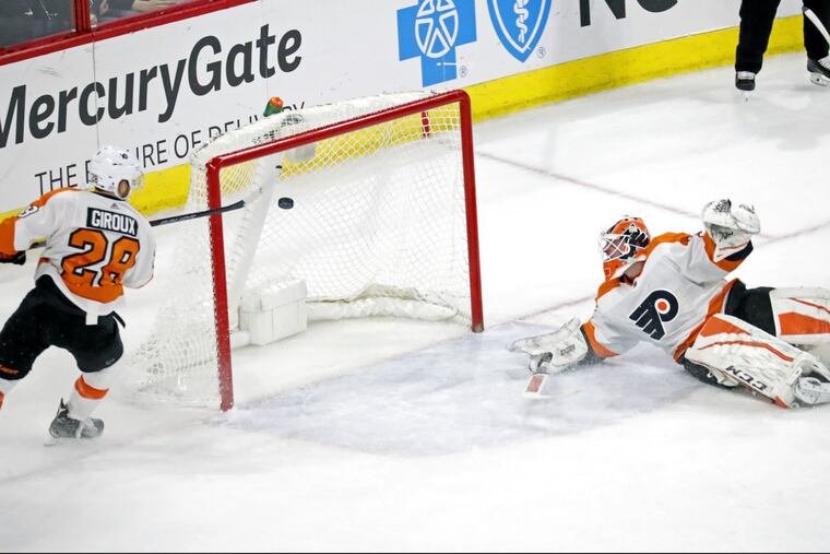 The Flyers’ Claude Giroux knocking Jordan Staal’s shot out of the air in the final seconds of overtime Tuesday. A few seconds later, Giroux made a sliding save to prevent Jeff Skinner from scoring.