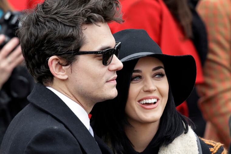 John Mayer and Katy Perry arrive at the ceremonial swearing-in for President Barack Obama at the U.S. Capitol during the 57th Presidential Inauguration in Washington, Monday, Jan. 21, 2013. (AP Photo/J. Scott Applewhite