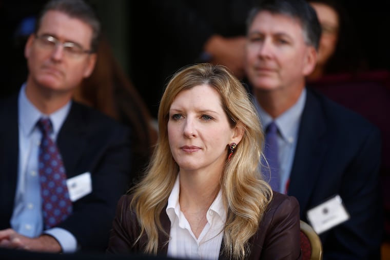 White House counsel Kathryn Ruemmler listens as President Barack Obama speaks at an installation ceremony for FBI Director James Comey at FBI Headquarters in Washington on Oct. 28, 2013.