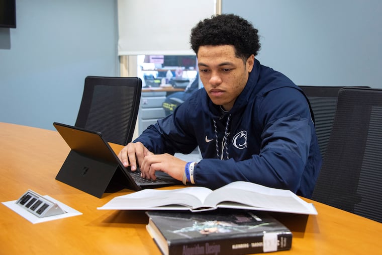 Penn State defensive back John Reid works on his academics as a data sciences major.