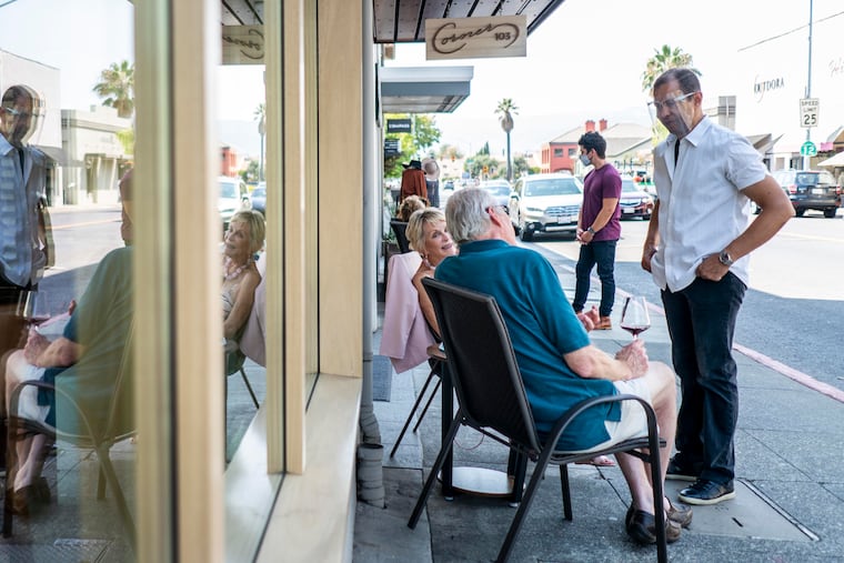 Lloyd Davis, right, owner of the tasting room Corner 103, in Sonoma, Calif., on Sept. 3, 2020. Washington Post photo by Melina Mara
