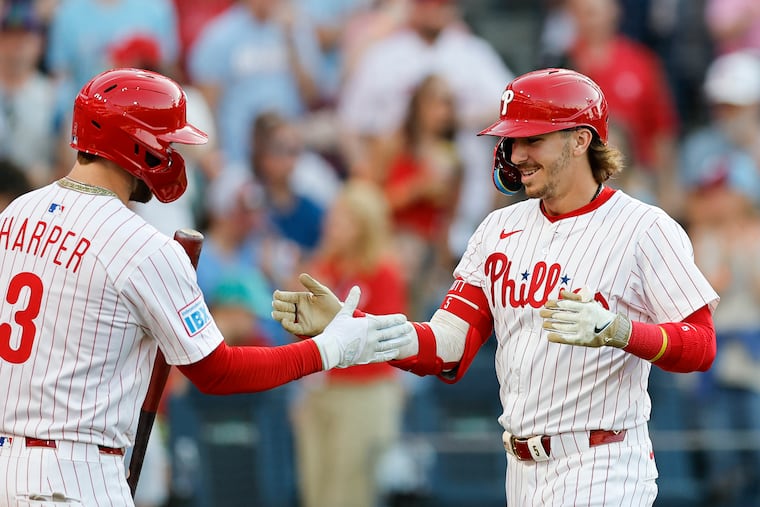 Phillies Bryson Stott celebrate his third inning solo home run with teammate Bryce Harper against the Pittsburgh Pirates.