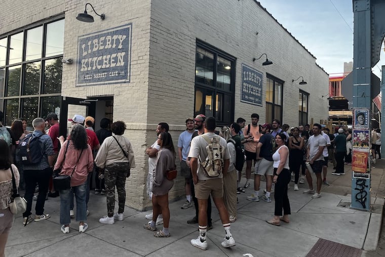 Hundreds of people wait in line at Liberty Kitchen in Fishtown to try Kosuke and Tomomi Chujo's Tokyo cheesesteak on April 30, 2025. This is the first time the Japanese couple has brought their cheesesteaks to Philadelphia. They've gained popularity in the city based on their love for Philly.