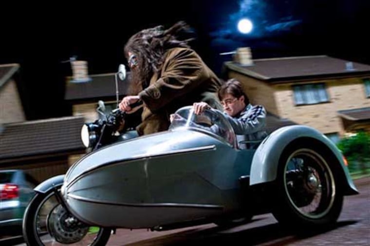 Robbie Coltrane, left, and Daniel Radcliffe in a scene from "Harry Potter and the Deathly Hallows: Part 1."