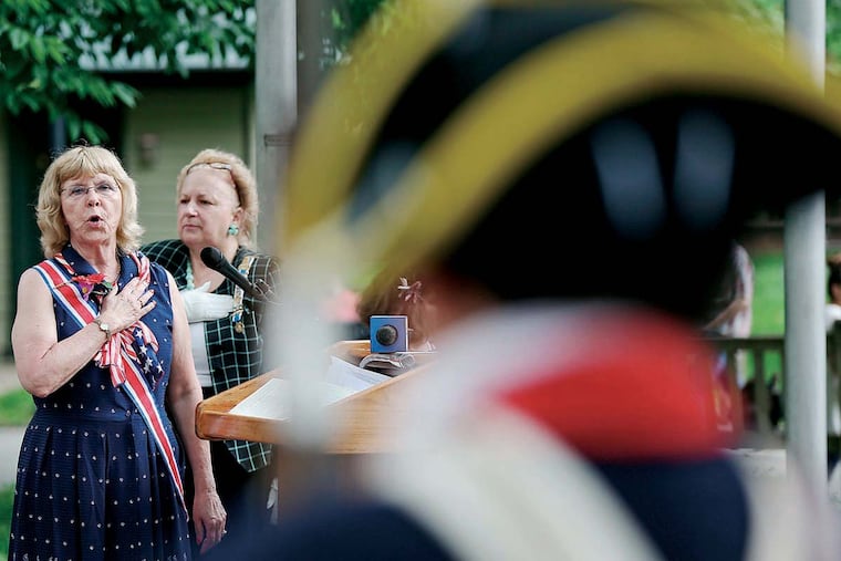 Nancy B. Popielarski, of the New Jersey State Society of Mayflower Descendants, sings the National Anthem during the 22nd annual Memorial Day Commemoration at the Tomb of the Unknown Soldier in Washington Square in Philadelphia, PA on May 30, 2016.