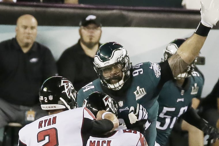 Haloti Ngata tries to break up a Matt Ryan Pass on the opening drive.