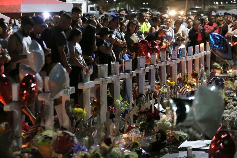 Hundreds of El Pasoans hold vigil Monday, August, 5, 2019, outside the Walmart in El Paso, Texas where Saturday, 22 people were shot and killed and 24 others were wounded. A tragedy like the August, 3, mass murder brought togther an otherwise peaceful community of 700,000; 2 million when you count Juarez.