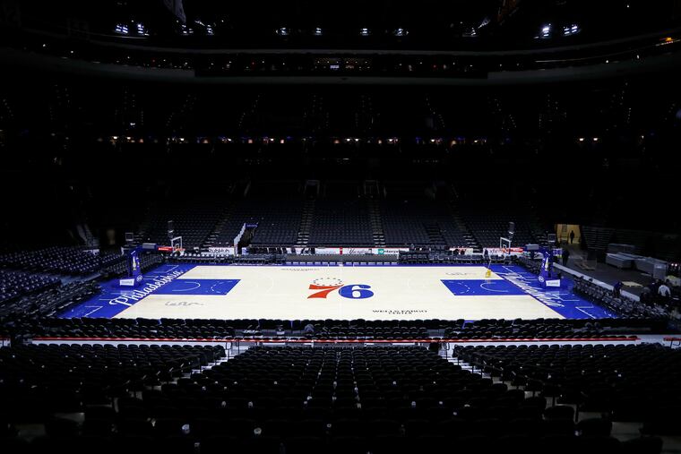 The empty court is seen at the Wells Fargo Center after the 76ers' final game before last year's pandemic shutdown.