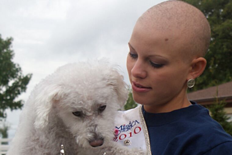 Kayla Martell, the current Miss Delaware, with her dog, Bridgette. She was diagnosed with alopecia areata at age 10. (Katie Pingon)