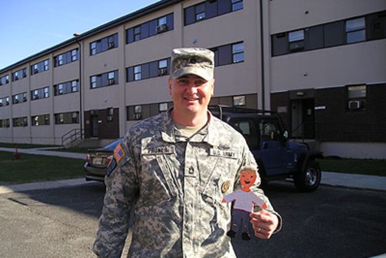 Marcel Pruner, who is graduating from BCC on Saturday after 20 years of military service and five deployments, shown here with Flat Stanley. (Photo courtesy of the Pruner family)