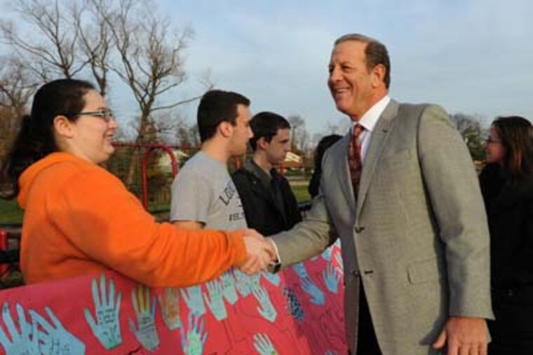 Cherry Hill Mayor Chuck Cahn greets young antismoking advocate Samantha Acampo. APRIL SAUL / Staff Photographer
