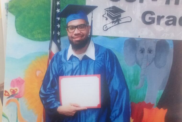 Terrance Lewis graduates from a paralegal certificate program in prison.