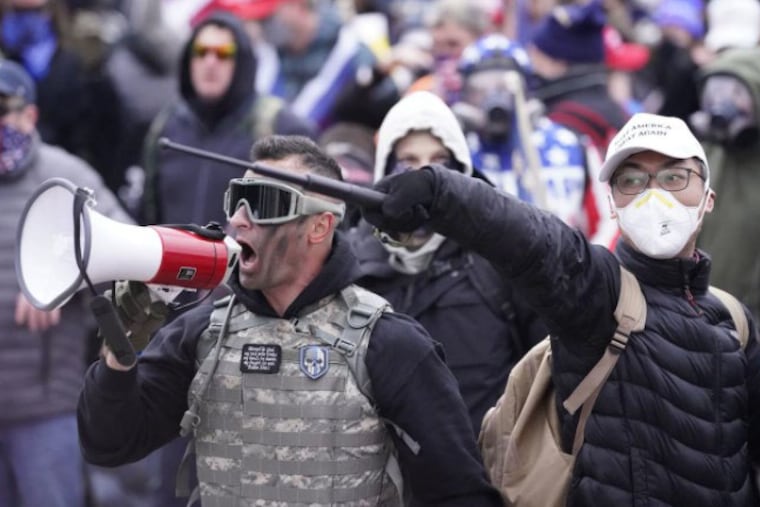 Samuel Lazar, 37, of Ephrata, is pictured shouting to the crowds outside the Capitol in Washington on Jan. 6.