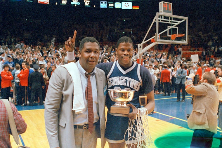 In this March 9, 1985 photo, Georgetown coach John Thompson poses with star center Patrick Ewing after the Hoyas defeated Houston in the NCAA college basketball championship game in Seattle.