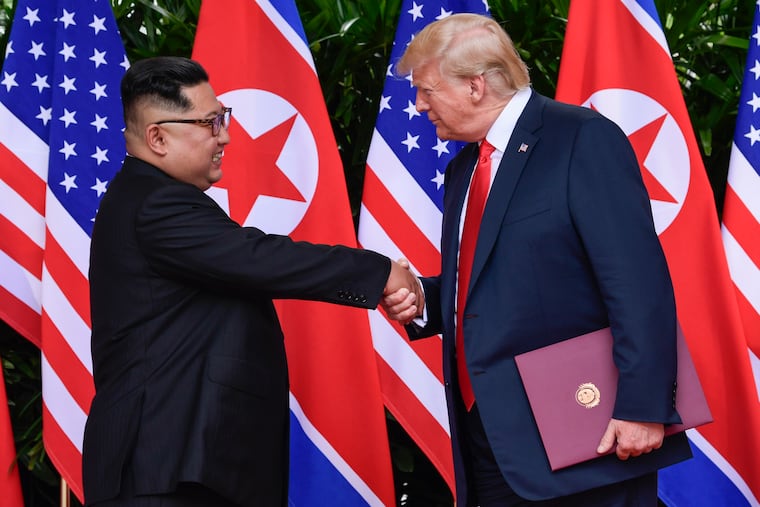 In this June 12, 2018, file photo, North Korean leader Kim Jong Un, left, and U.S. President Donald Trump shake hands at the conclusion of their meetings at the Capella resort on Sentosa Island in Singapore.