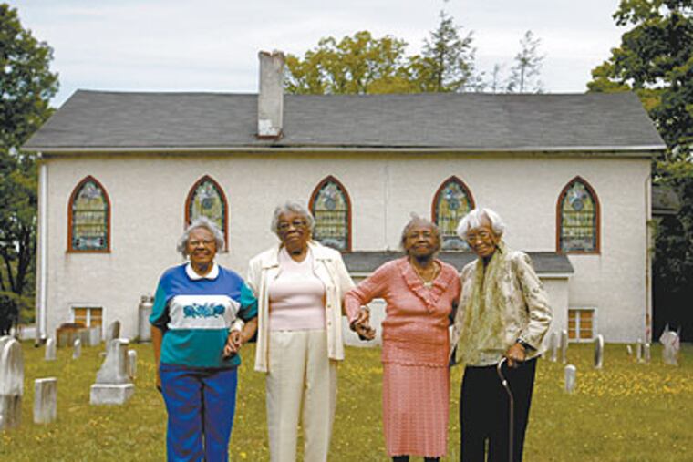 From left to right, Estelle King Burton, 88, Bessie Cunningham, 92, Elsie Fuller, 92, and Bessie Whitney, 95, outside Mount Zion A.M.E. Church in Devon. (Michael S. Wirtz / Staff Photographer)
