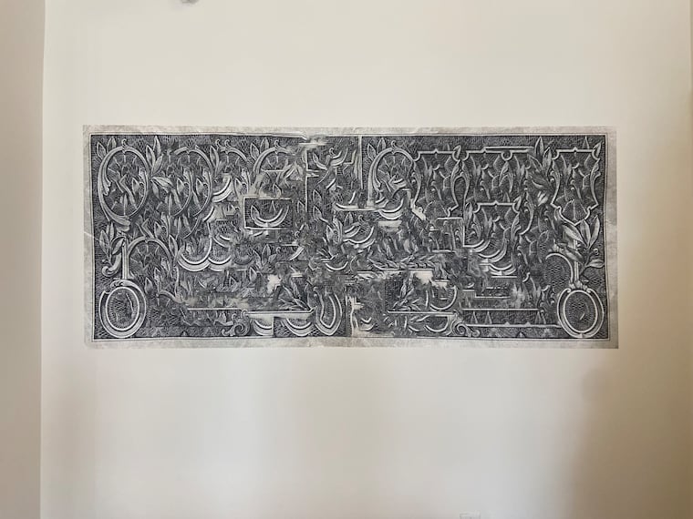 A large prototype of artist Kaitlin Pomerantz's "Rewilded Dollar" hung at the entrance of the exhibit. It is a digital collage on adhesive vinyl.