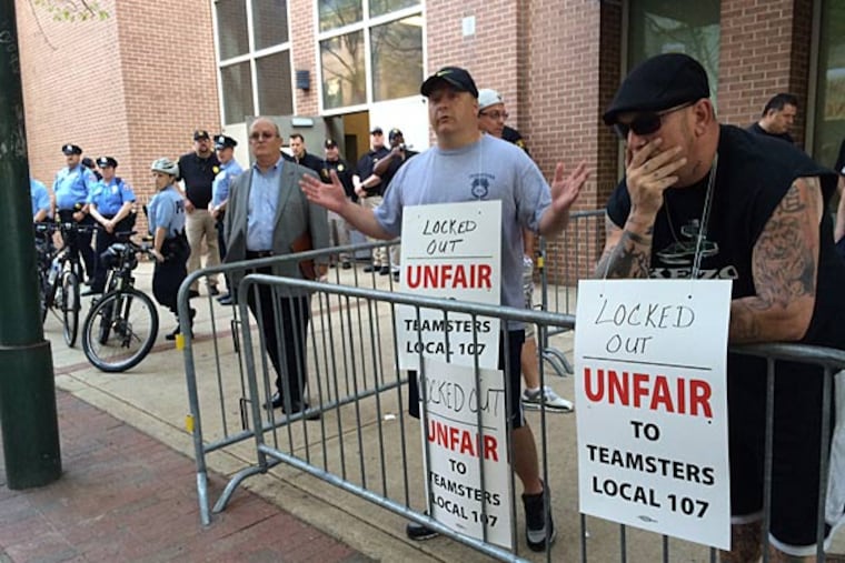 Teamsters Local 107 members gather outside the Pennsylvania Convention Center at the employee entrance along 11th Street near Race in Center City Philadelphia on Monday morning May 12, 2014. ( Alejandro A. Alvarez / Staff Photographer )