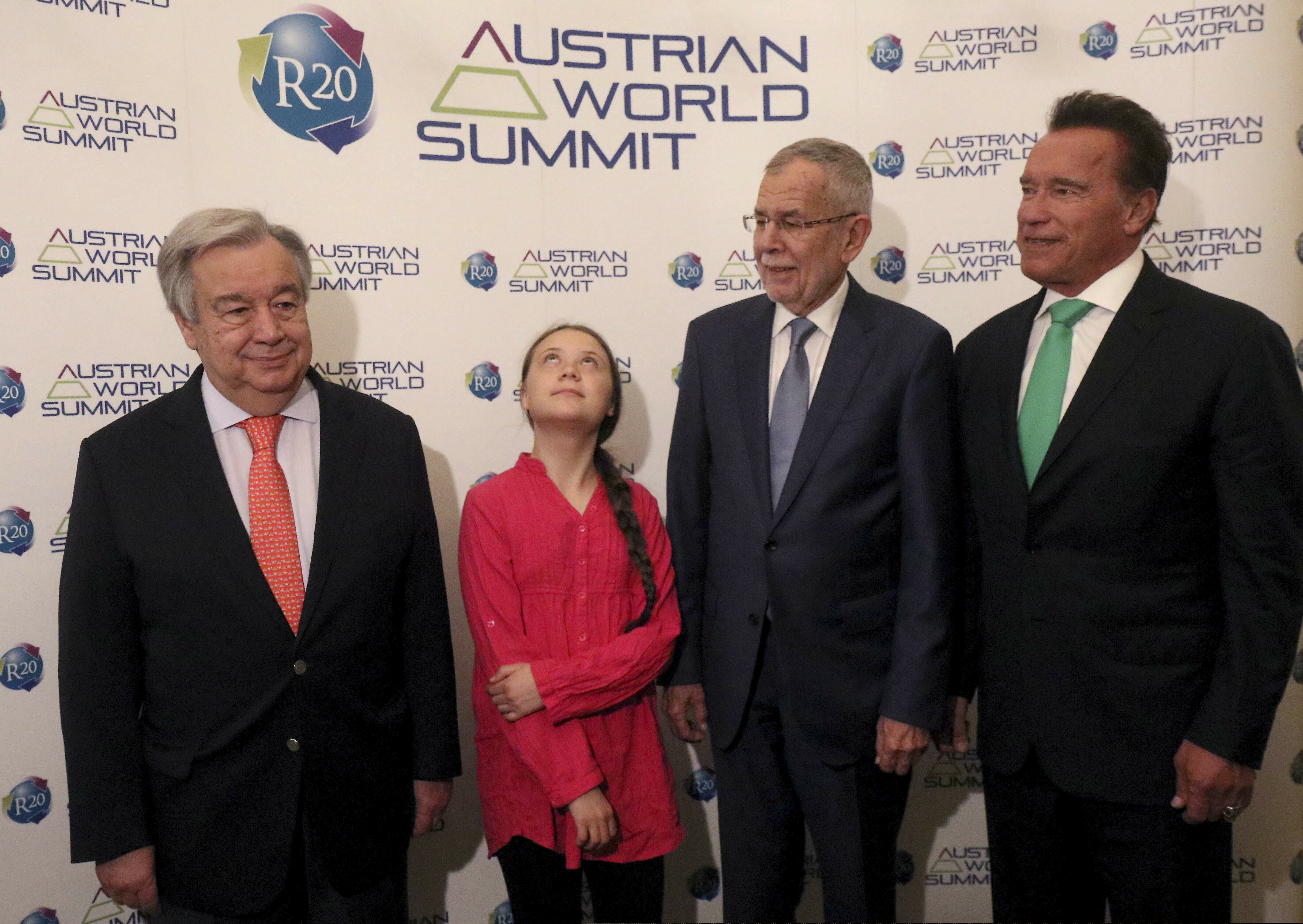 United Nations Secretary-General Antonio Guterres, Swedish climate activist Greta Thunberg, Austrian President Alexander Van der Bellen and former California Gov. Arnold Schwarzenegger, from left, pose before the R20 Austrian world summit at Hofburg palace in Vienna, Austria, Tuesday, May 28, 2019.