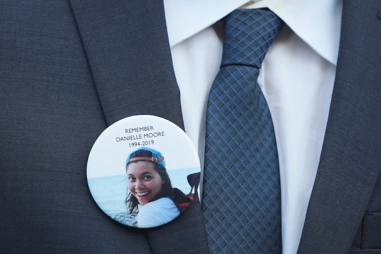 A family member wears a photo of Boeing crash victim Danielle Moore before a hearing at federal court in Fort Worth, Texas, in September.