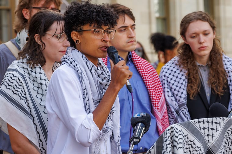 Swarthmore College student Jace Boland, one of nine protestors facing charges, speaks at a news conference Tuesday outside the Delaware County Courthouse.