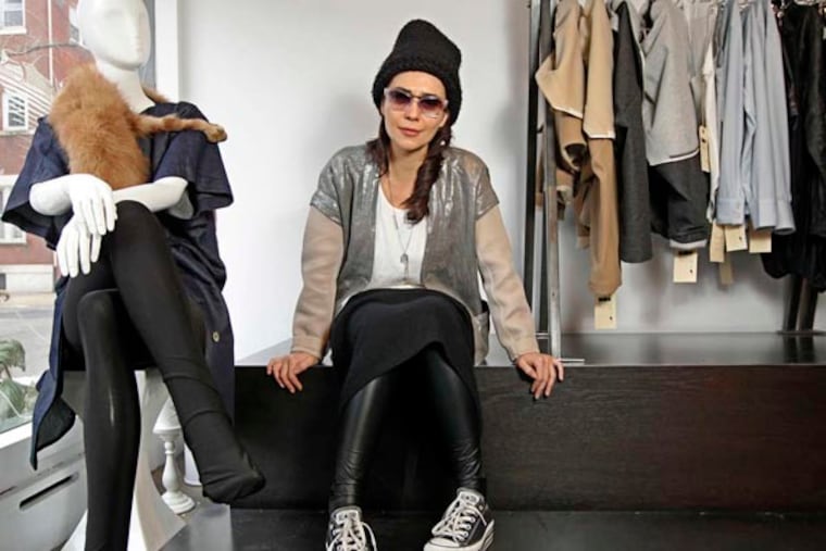 Fashion designer Bela Shehu sits in her Rittenhouse Square showroom surrounded by her clothes. Can you please shoot Bela Shehu in her showroom... I believe she has some sewing machines in there. If you would shoot her with a seamstress or at a drafting table, that would be great. If not a portrait shot should be okay. Something with clothing. 02/05/2014( MICHAEL BRYANT / Staff Photographer )