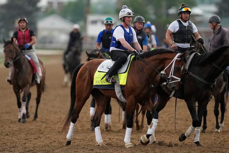Journalism, the winner of the Santa Anita Derby, comes off the track after a Kentucky Derby workout at Churchill Downs on Tuesday.