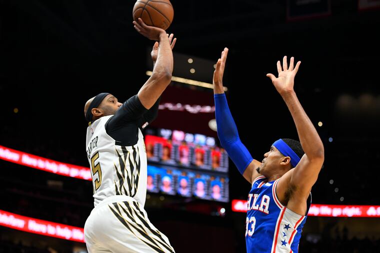 Tobias Harris (right), here defending the Hawks' Vince Carter, can use more quality time with his fellow Sixers starters before the playoffs.
