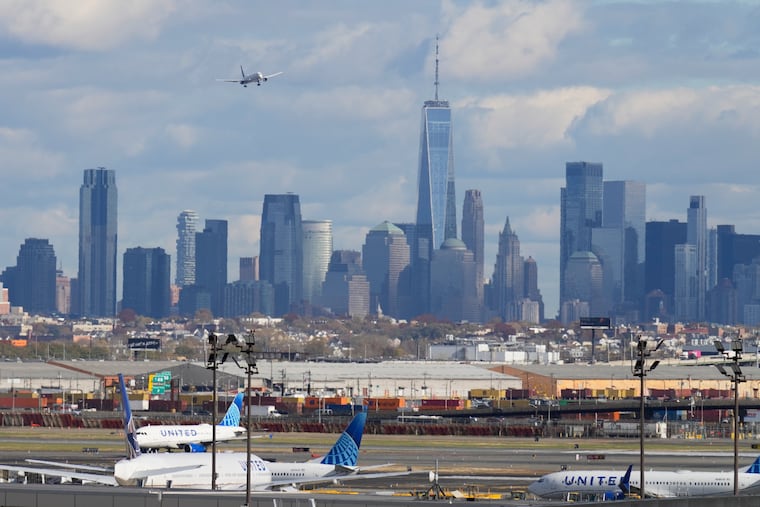 FILE - The New York City skyline is seen behind a plane approaching Newark International Airport in Newark, N.J., Nov. 6, 2025.