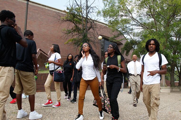Students leave Chester High School at the end of the day. Hundreds of students, teachers, staff, and others had gathered outside the school earlier for an annual bell-ringing ceremony. (CHARLES FOX/Staff Photographer)