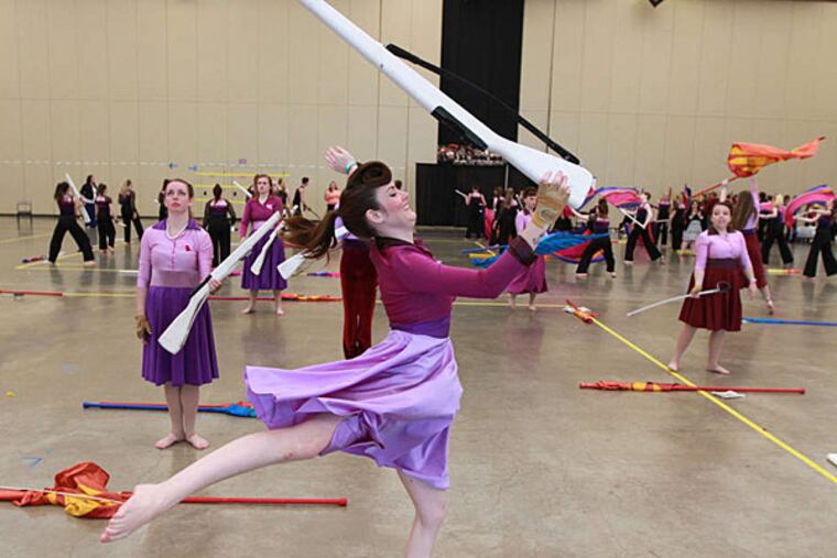 Megan Gross, 22, warms up before the competition. The Tournament of Bands contest drew 233 units from about 125 schools and programs in seven states. DAVID SWANSON / Staff Photographer