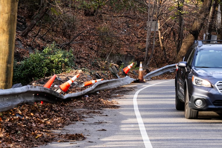 Cresheim Valley Drive is pictured on Dec. 1, 2025, with a downed guardrail where a 65-year-old man crashed and later died Sunday evening. Neighbors say Cresheim Valley Road and nearby Lincoln Drive are constant sources of crashes, sometimes fatal.