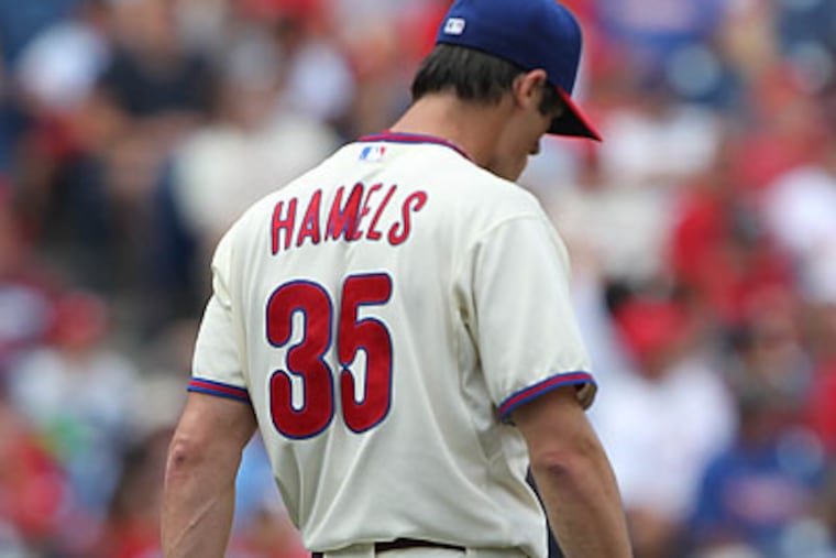 Cole Hamels suffered a contusion to his right hand after being hit by a line drive from Adrian Gonzalez. (David M Warren/Staff Photographer)