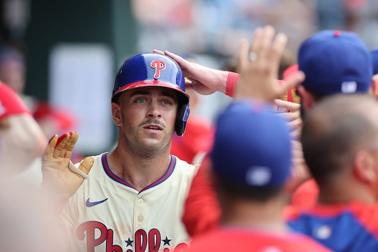 Philadelphia Phillies first baseman Otto Kemp is congratulated in the dugout after hitting a solo home run in the sixth inning as the Phillies play the Angels in Philadelphia on Sunday, July 20, 2025. Phillies lose 8-2.