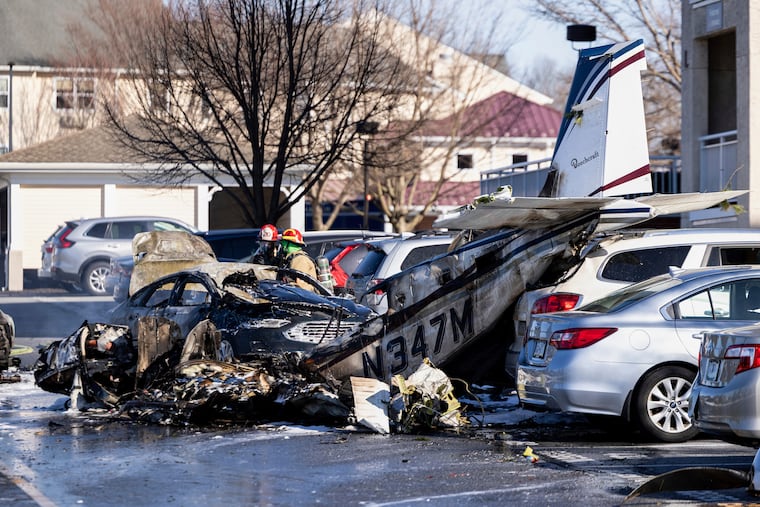 First responders work the scene after a plane crashed in the parking lot of a retirement community in Manheim Township, Pa., on Sunday, March 9, 2025.