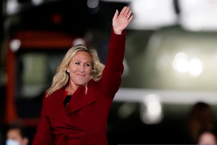 Rep. Marjorie Taylor Greene, R-Ga., shown waving as then-President Donald Trump spoke at a campaign rally in support of Senate candidates Sen. Kelly Loeffler and David Perdue in Dalton, Ga., on Jan. 4.