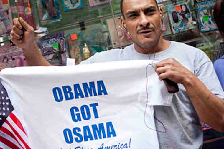 A man waits for President Obama to make an appearance at a fire station in New York. It's unlikely bin Laden's death will affect 2012 elections. (Andrew Burton / Associated Press)