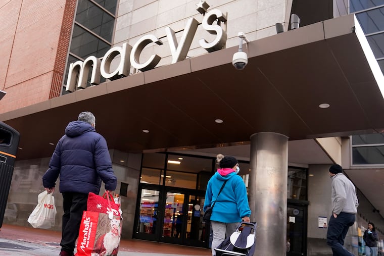 Shoppers walk to the Macy's store in the Downtown Crossing district in Boston.