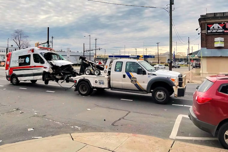 A Medstar ambulance is towed from the scene at Torresdale and Harbison Avenues in Frankford early Sunday morning Mar. 15 2026. An infant was killed earlier when the ambulance sped through a red light and crashed into a car, police said.