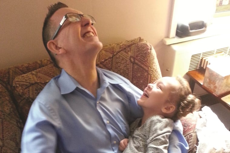 Sociologist Patrick Carr, who died on April 16, in an undated photo, playing with his daughter, Calliope, now 10, who is afflicted with an untreatable genetic disease.