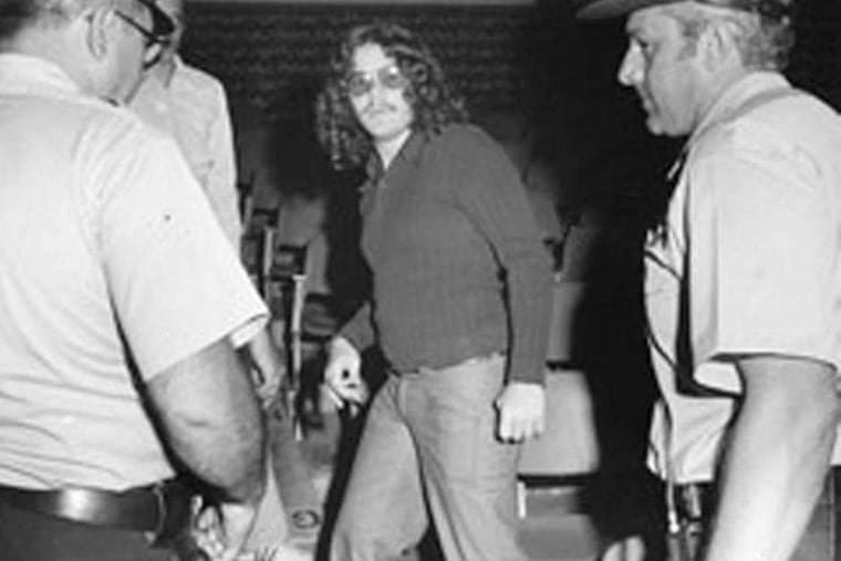 Run-ins with the law were par for the course during Mark Segal's days as a Gay Raider. Here, he's about to get thrown out or taken in by law enforcement.