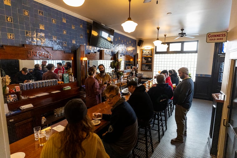 People enjoying drinks at the bar at the Meetinghouse in Philadelphia, Pa., on Wednesday, Nov., 8, 2023.