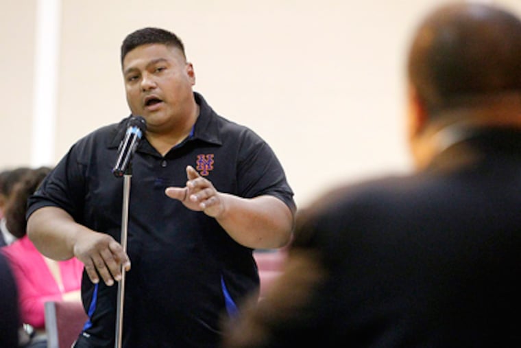 Cherry Hill resident Israel Serrano voices his opposition to open Charter School in Cherry Hill during the Q&A session. (Akira Suwa / Staff Photographer )