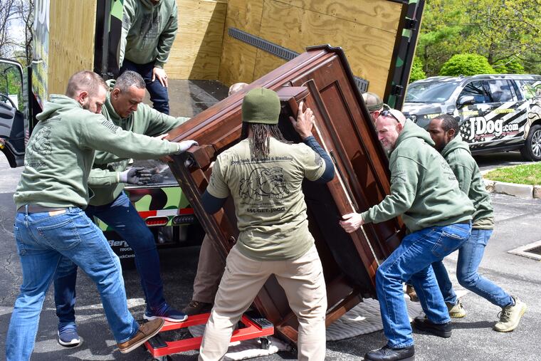In an episode of "Operation Hidden Treasures," a goup of workers at JDog Junk Removal and Haulings receive training at JDog University on the proper way to remove heavy items -- in this case a piano.