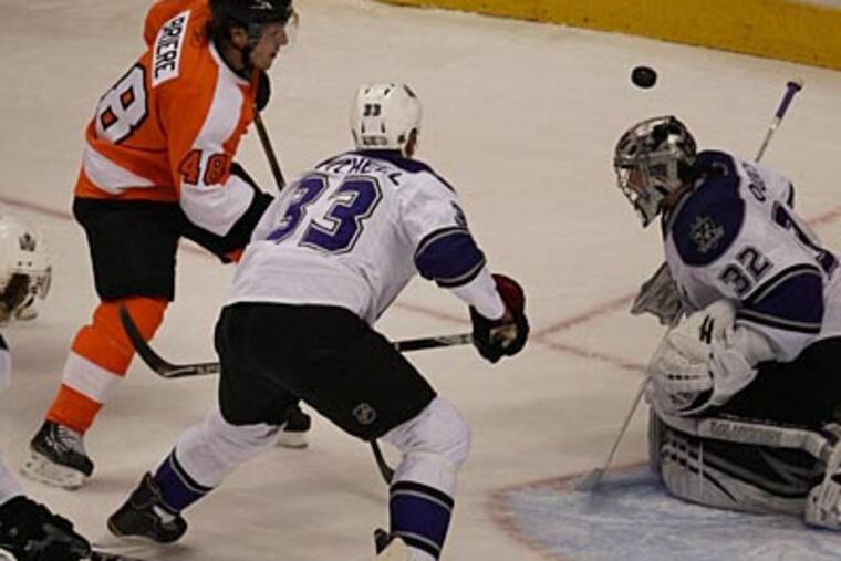 Kings Jonathan Quick makes a save against Danny Briere during the Kings' 1-0 win. (David M Warren/Staff Photographer)