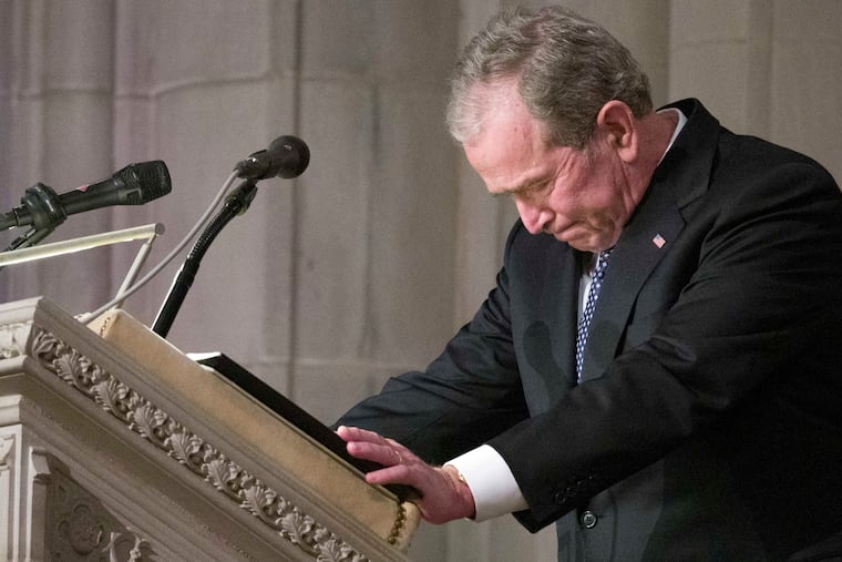 Former President George W. Bush becomes emotional as he speaks at the State Funeral for his father, former President George H.W. Bush at the National Cathedral Wednesday in Washington.