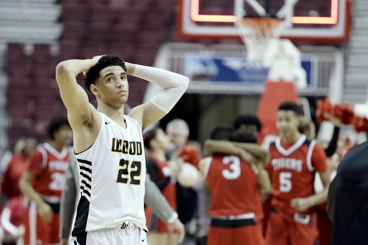 Archbishop Wood # 22 Daeshon Shepherd reacts as Moon celebrates in the background after the Archbishop Wood vs. Mars H.S. PIAA Class 5A boys' basketball state championship game at the Giant Center in Hershey, Pa. on March 22, 2019. Archbishop Wood lost the game 74-64.