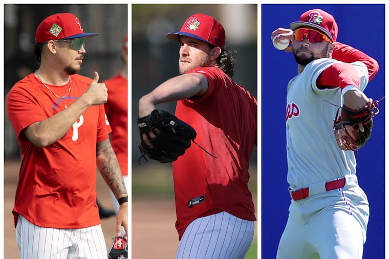 From left: Phillies pitchers Orion Kerkering and Aaron Nola, and outfielder Justin Crawford.